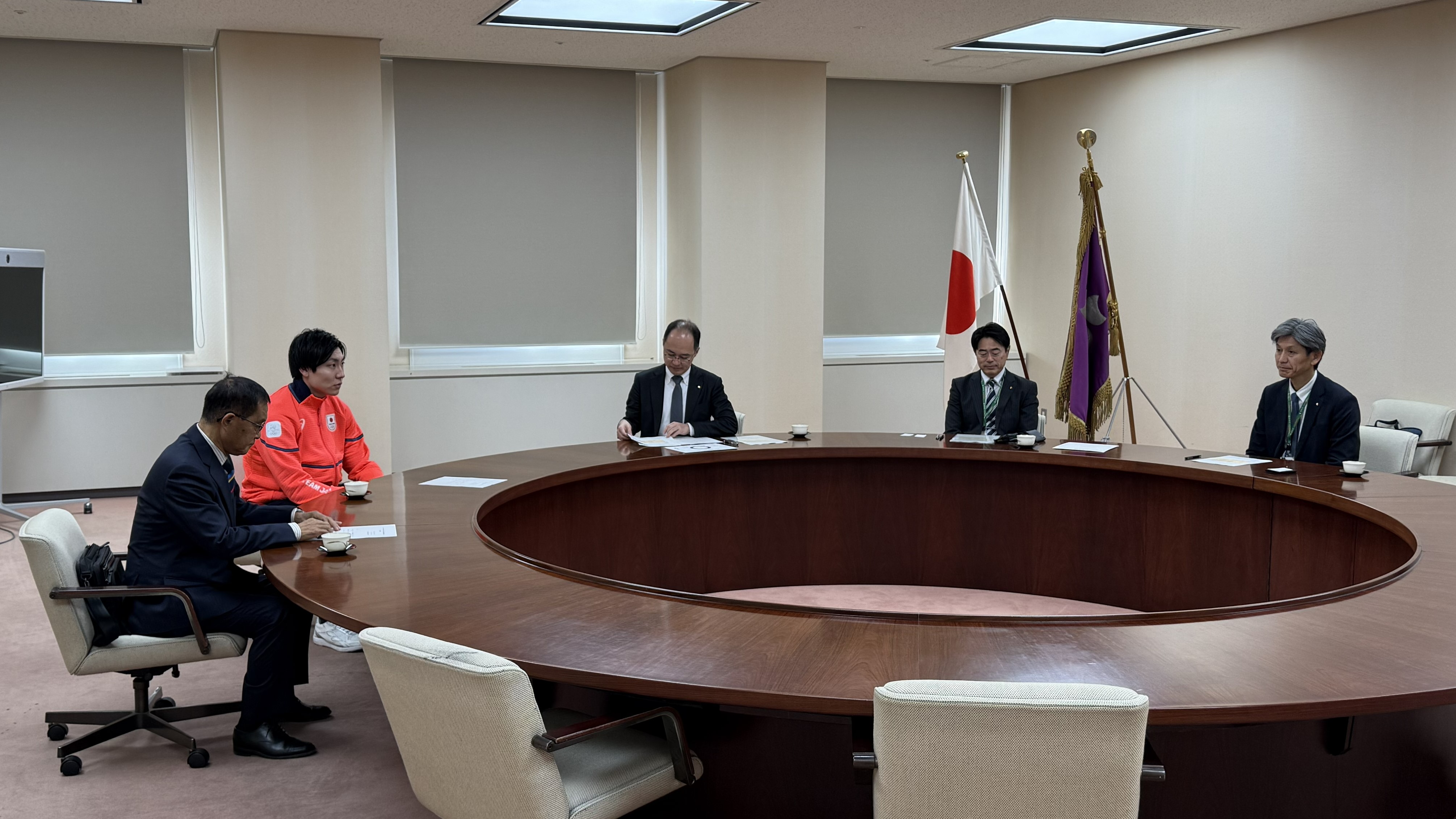 新濱選手による結果報告時の写真